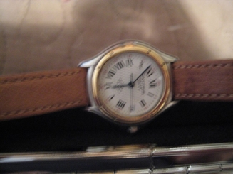 Cartier watch 18k and SS. quartz w/ date ronde ladies