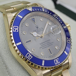 Rolex SUBMARINER 16618 Mens Yellow Gold Oyster Slate Serti Sapphire Dial 40MM