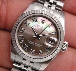 BRAND NEW LADIES SS/WG ROLEX DATEJUST BLACK MOTHER OF PEARL ROMAN DIAL 179174